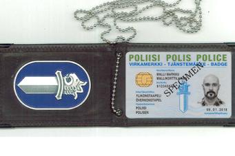 Police officers’ badge holder and a metal emblem.