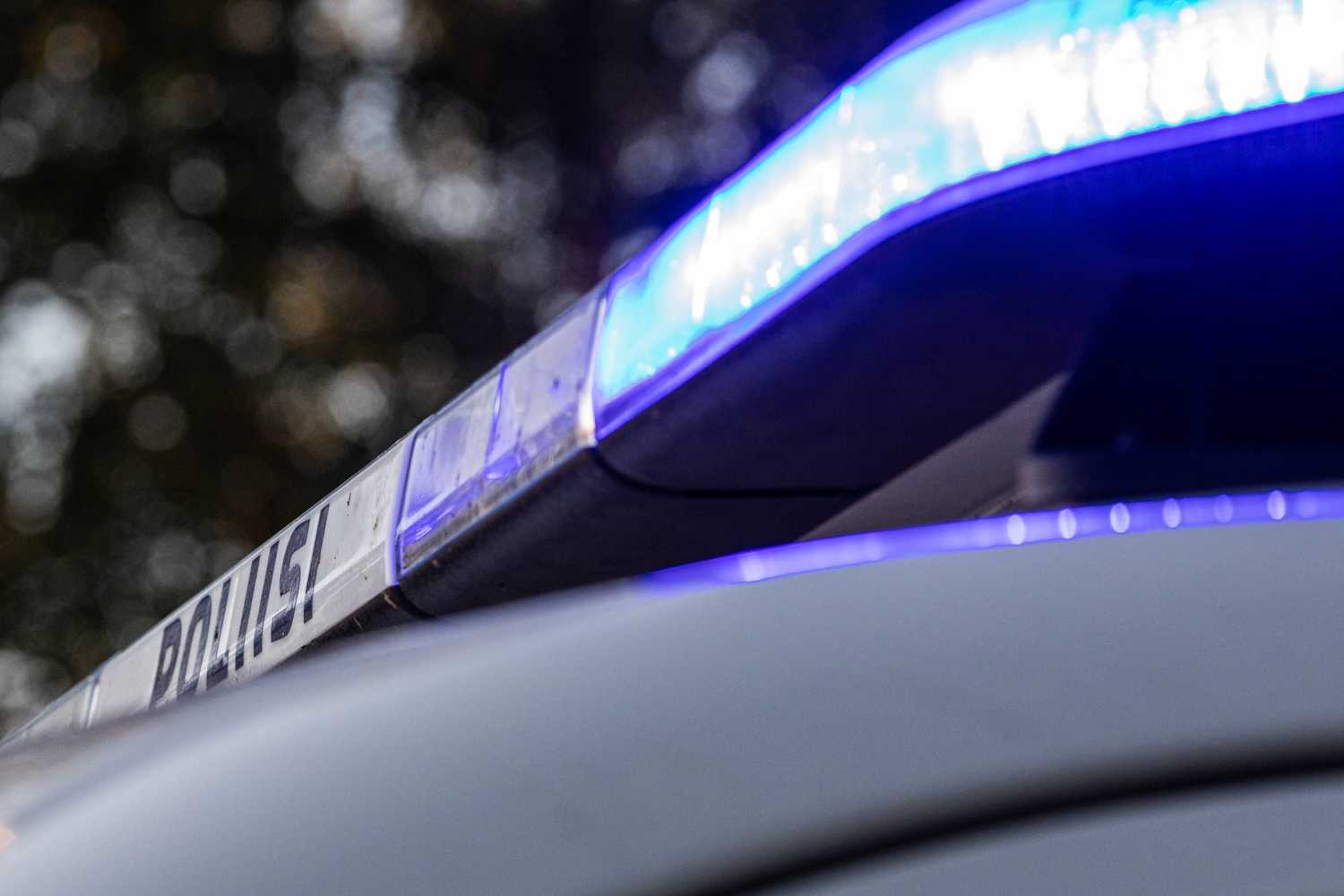 Police car light panel, blue light with alarm light on.